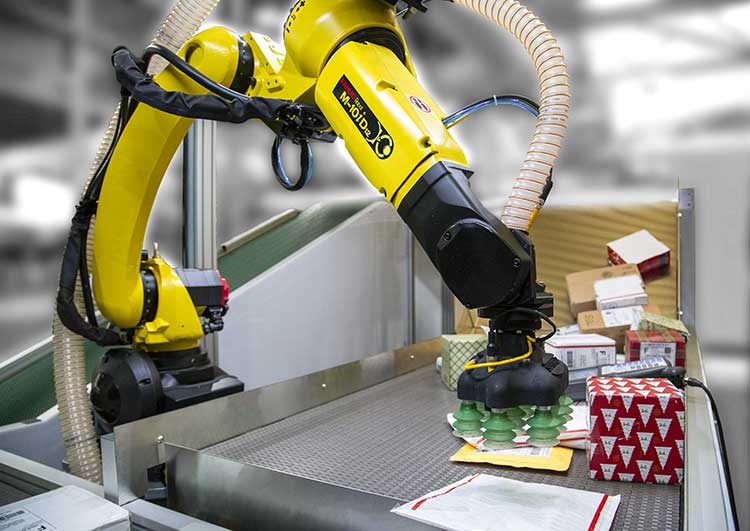 Yellow Robotic Arm Sorting Packages